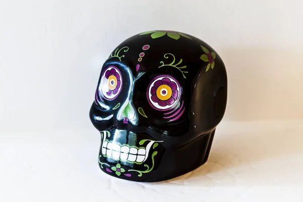 Black ceramic mini sugar skull facing forward. Die of the Dead Sugar Skull Ceramic Decoration