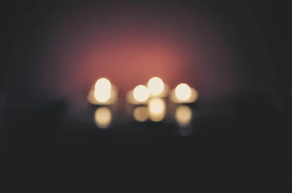 Bokeh Photo Four Glowing Candles Light Moody Decor Concept — Stock Photo, Image