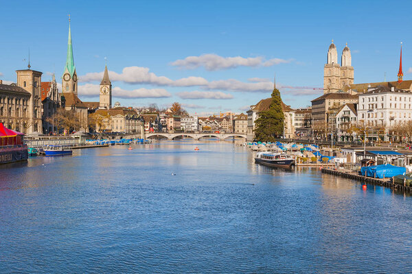 Zurich, Switzerland - November 25, 2013: view along the Limmat river, buildings of the historic part of the city. Zurich is the largest city in Switzerland and the capital of the Swiss canton of Zurich.