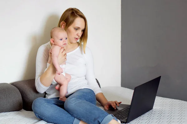 young mother works on freelancin