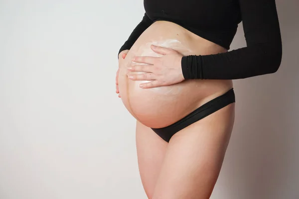 pregnant woman  cream cream belly