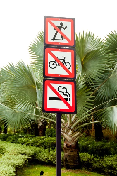 Prohibition signs in the Park. Not to skate, smoke, bike. — Stock Image Prohibition signs in the Park. Not to skate, smoke, bike. Stock Image