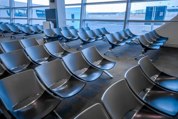 waiting room at the airport with gray chairs