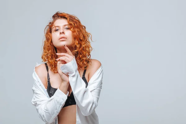 Redhead girl in black lingerie and white shirt — Stock Photo, Image