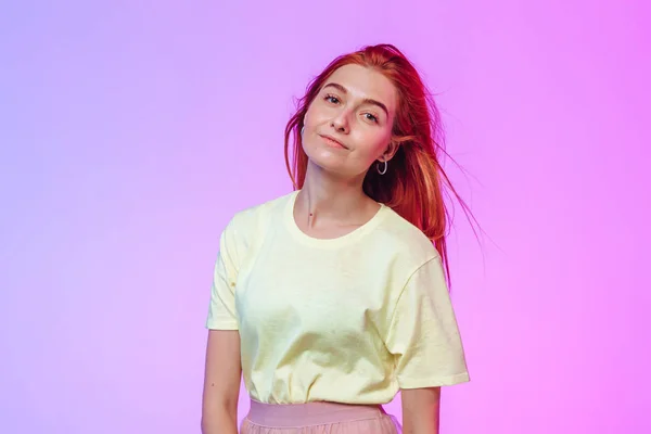 Red-haired girl posing on a colored background — Stock Photo, Image