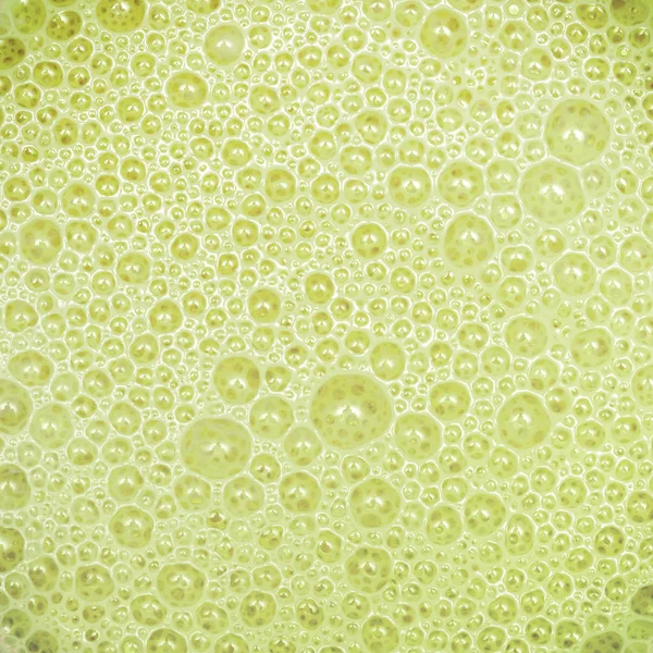 Молочный Коктейль Авокадо Текстурой Зеленые Пузырьки Пены Крайний Макро Крупным — стоковое фото