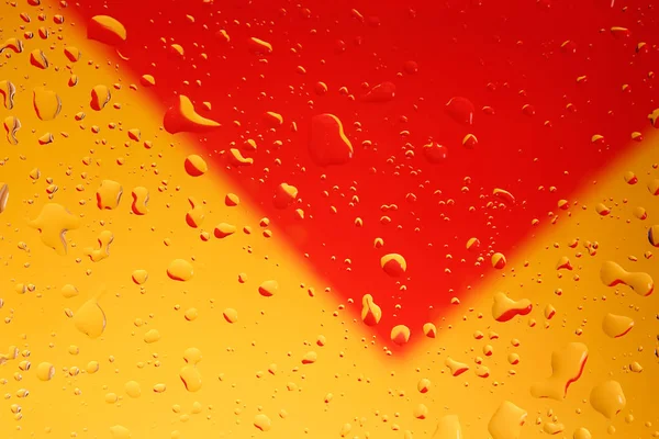 Krople Wody Szkło Przezroczyste Tło Żółty Czerwony — Zdjęcie stockowe