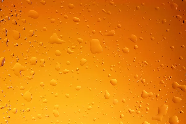 Krople Wody Szkło Przezroczyste Tło Żółty Oranage — Zdjęcie stockowe