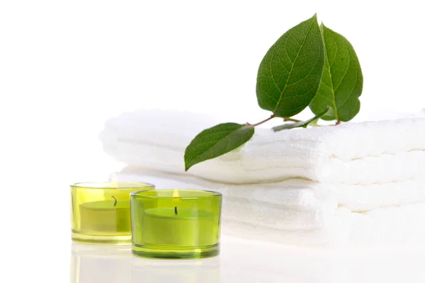 Candles White Towels Green Leafs Royalty Free Stock Images