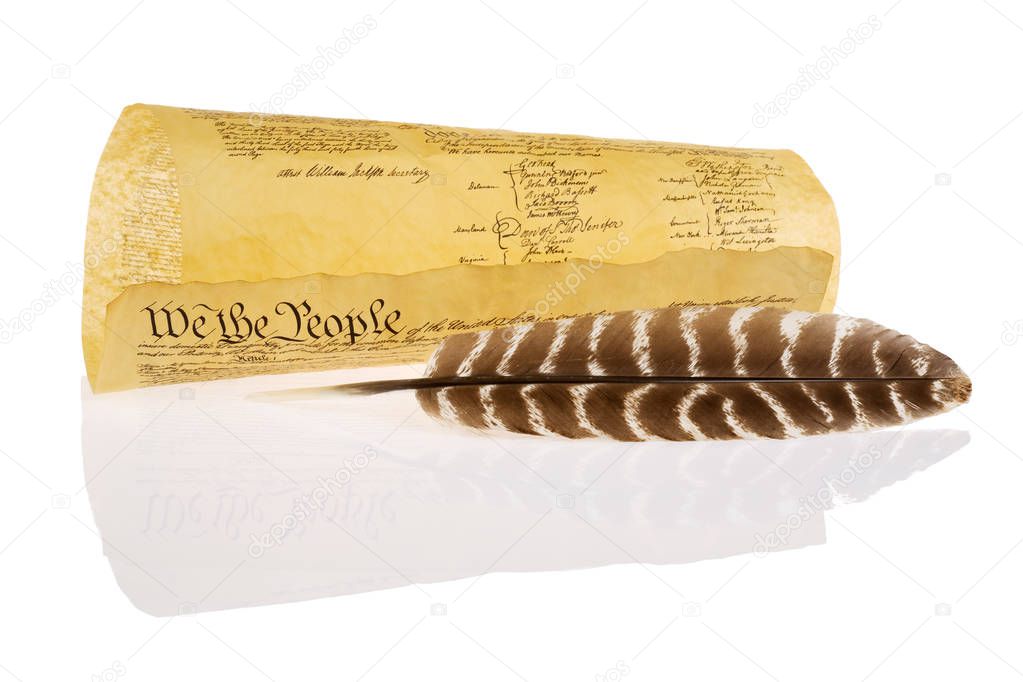 Quill and United States Constitution isolated on white