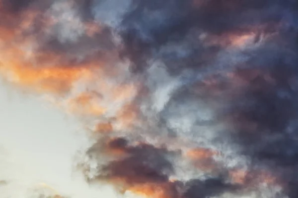 Beautiful bright sunset sky with pink clouds, natural abstract background and texture, heaven, religion