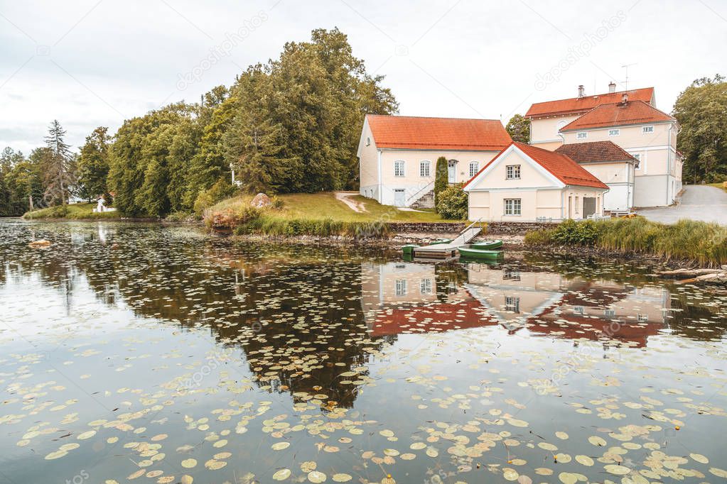 An old manor house Vihula in Estonia, Lahemaa park. Beautiful autumn landscape with pond
