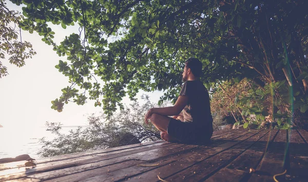 Young Man Meditating Wooden Platform Nature Sea View Sunset Shot — Stock Photo, Image