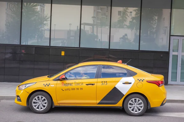 June 2019 Moscow Russia yellow yandex taxi in the street in the — Stock Photo, Image