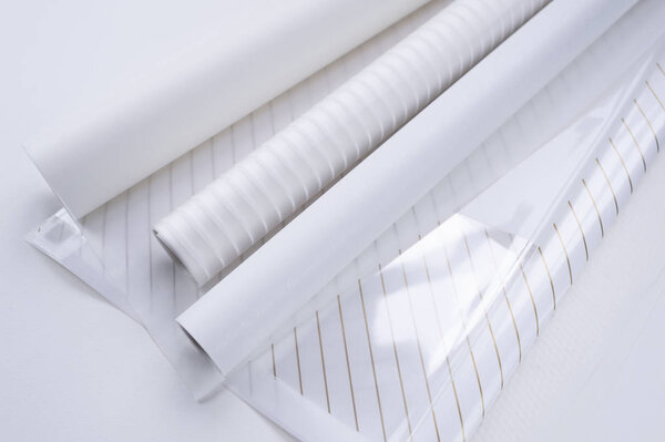 a lot of white packaging film or paper with a different texture