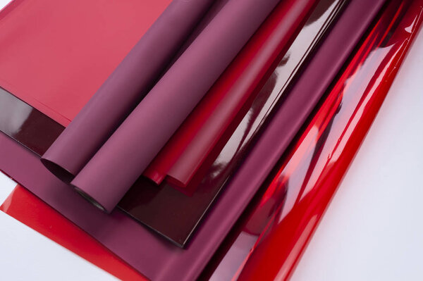 a lot of red packaging film or paper with a different texture