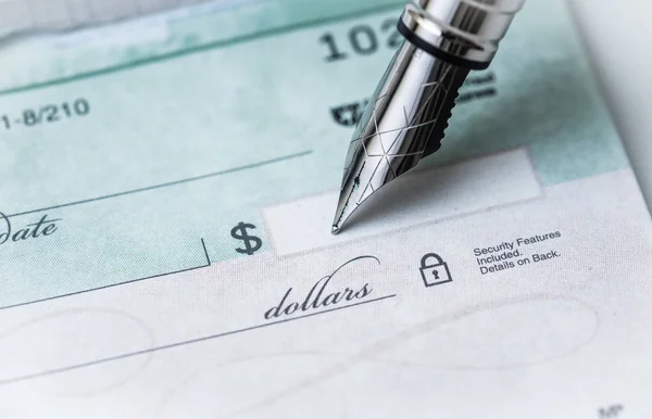 Making Payments Writing Check Stock Picture