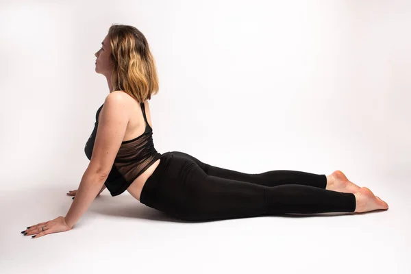 Female doing a cobra backbend yoga pose — Stock Photo, Image