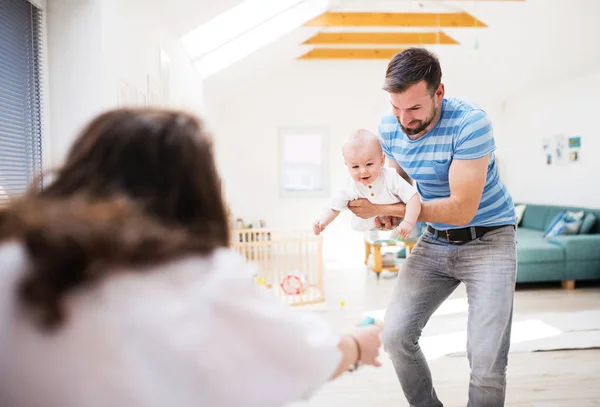 Young family with a baby boy at home, having fun. — Stock Photo, Image