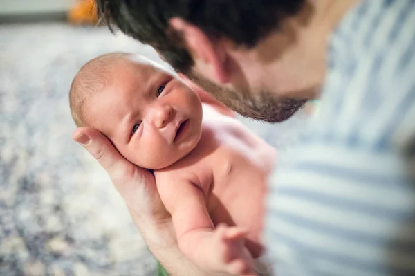 Father with a newborn baby at home. Copy space. — Stock Photo, Image