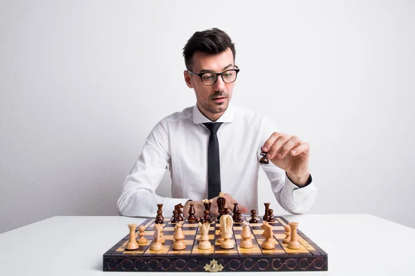 Premium Photo  Man playing chess against himself shot in the studio