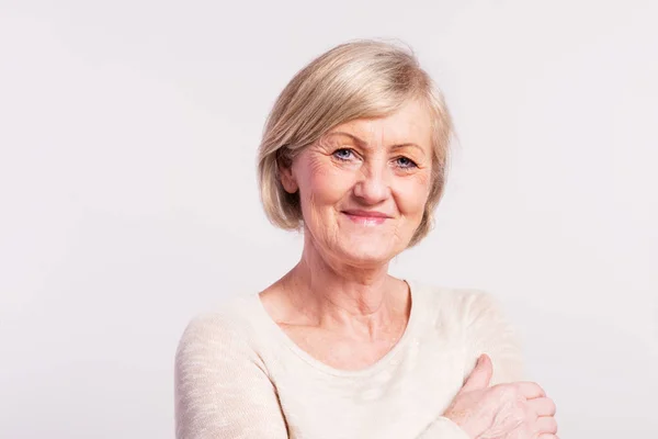 Portrait of a senior woman in studio. — Stock Photo, Image