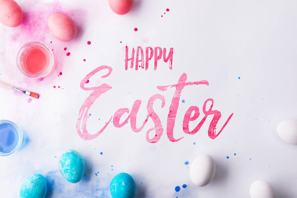 Happy Easter flat lay on a white background.