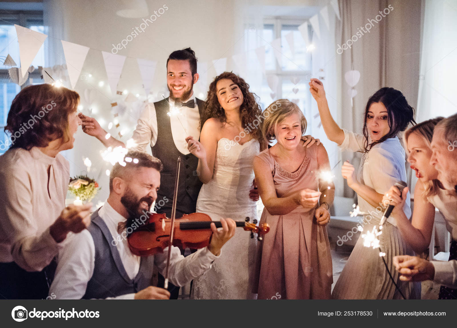 A Young Bride Groom And Other Guests Dancing And Singing On A