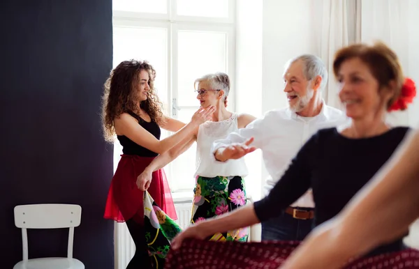 Group of senior people in dancing class with dance teacher. — Stock Photo, Image