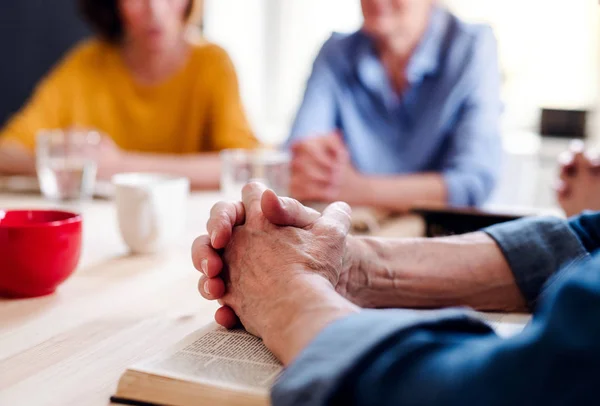 Midsection of senior people in bible reading group in community center club. — Stock Photo, Image