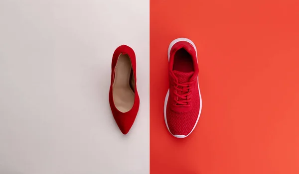 A studio shot of running vs high heel shoe on color background. Flat lay. — Stock Photo, Image