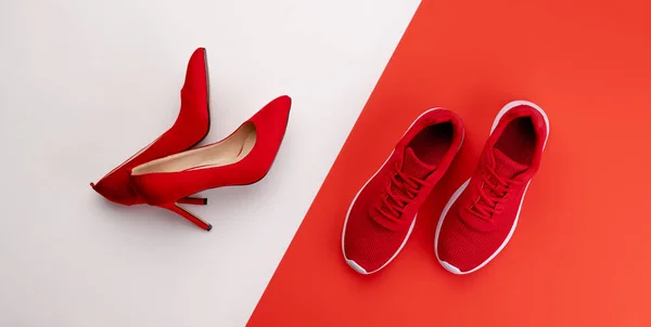 A studio shot of pair of running vs high heel shoes on color background. Flat lay. — Stock Photo, Image