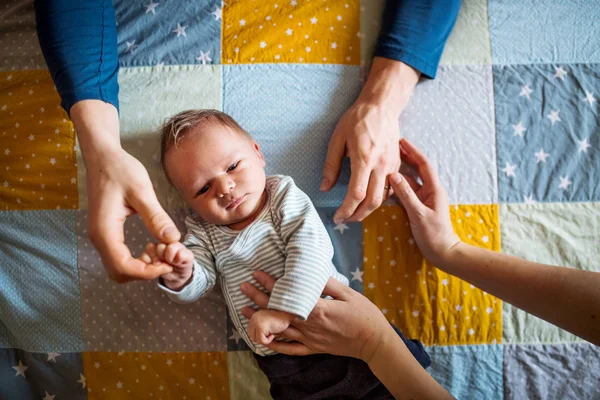 A top view of a newborn baby lying on bed at home. — Stock Photo, Image