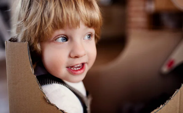 A close-up of toddler boy playing indoors at home. Copy space. — Stock Photo, Image