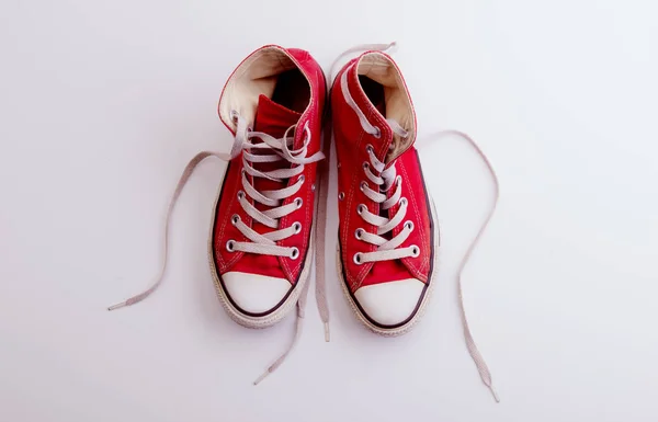 A studio shot of pair of canvas shoes on white background. Flat lay. — Stock Photo, Image
