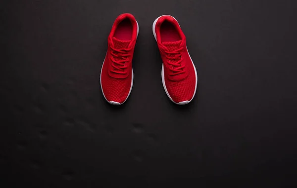 A studio shot of pair of running shoes on black background. Flat lay. — Stock Photo, Image