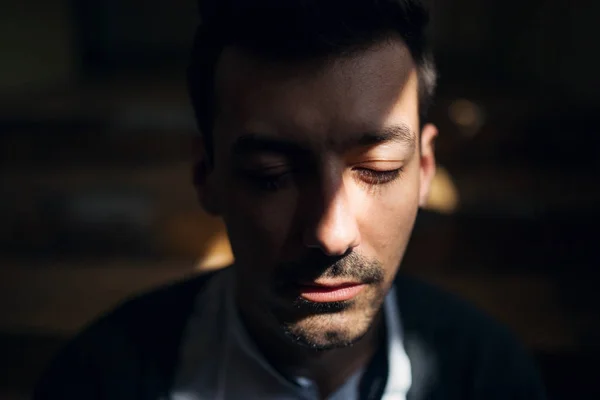 A portrait of young man indoors, a close-up. — Stock Photo, Image