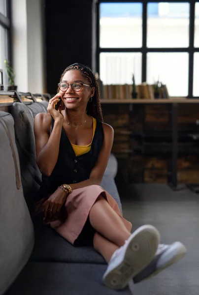 Portrait of young business woman indoors in office, using smartphone. — Stock Photo, Image