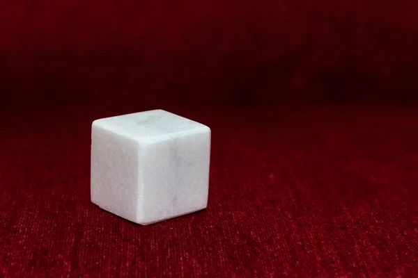 Polished Stone Cube Isolated Blurred Red Background Focus Ston — Stock Photo, Image
