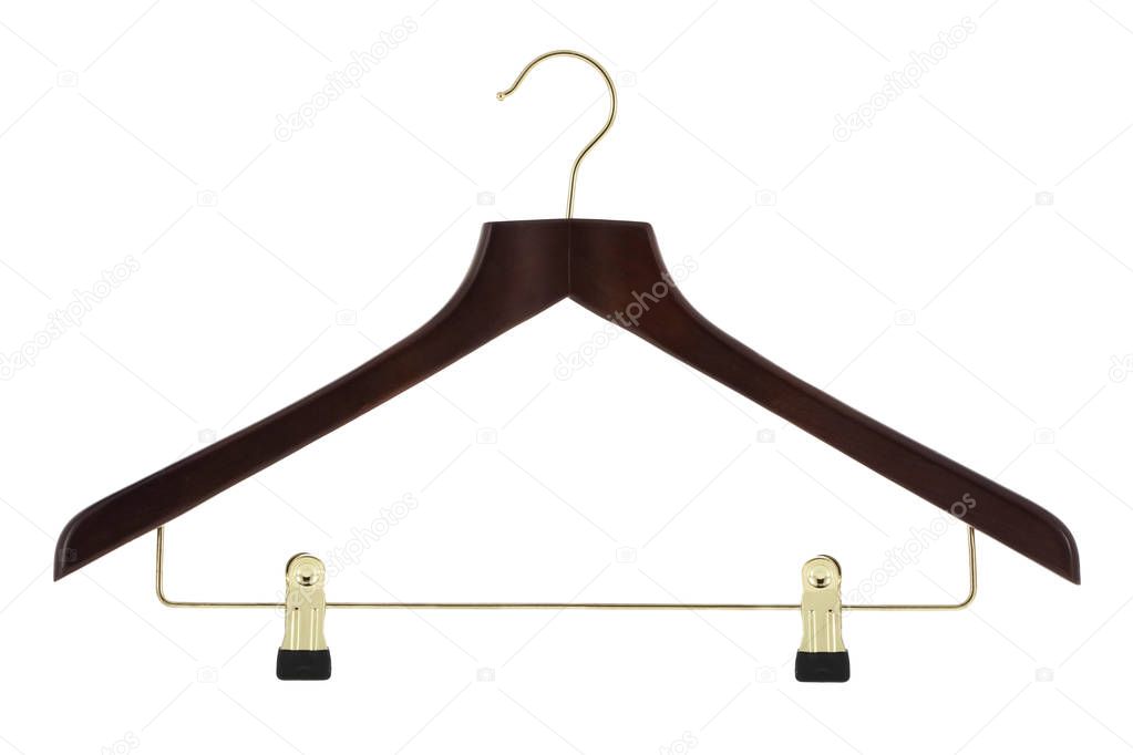 Dark ood clothes hanger with gold colored metal pants / skirt hanger isolated on a white background