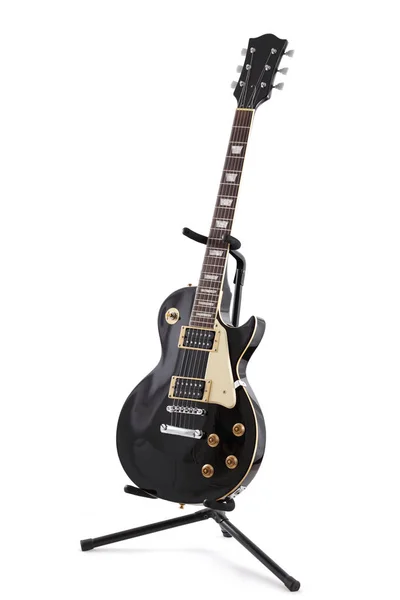 Siyah Elektrikli gitar bir stand üzerinde kırpma ile beyaz izole