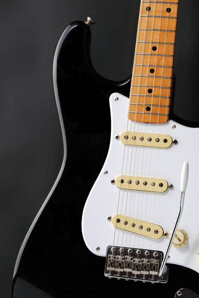 A retro black and white electric guitar body
