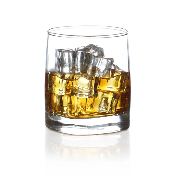Tumbler of Scotch with ice rocks isolated on white