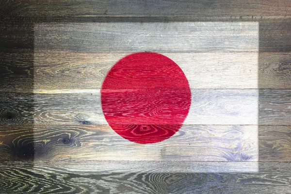 Giappone bandiera su rustico vecchio legno superficie di sfondo — Foto Stock