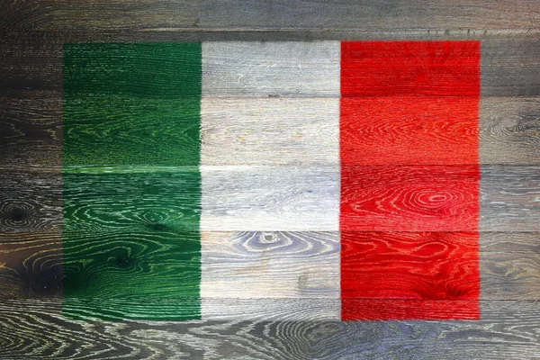 素朴な古い木の表面の背景にイタリアの旗 — ストック写真
