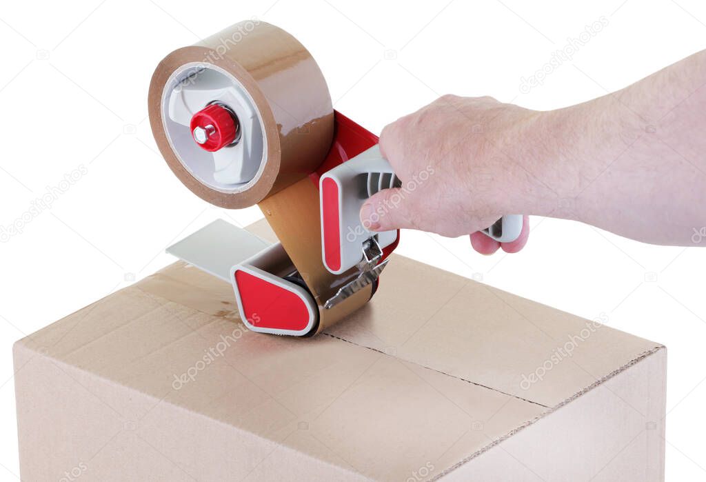 sealing a shipping cardboard box with adhesive tape dispenser