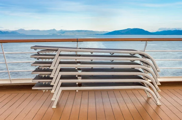 Stacked lounge chairs, Lido deck of cruise ship, Inside Passage, BC, Canada. — Stock Photo, Image