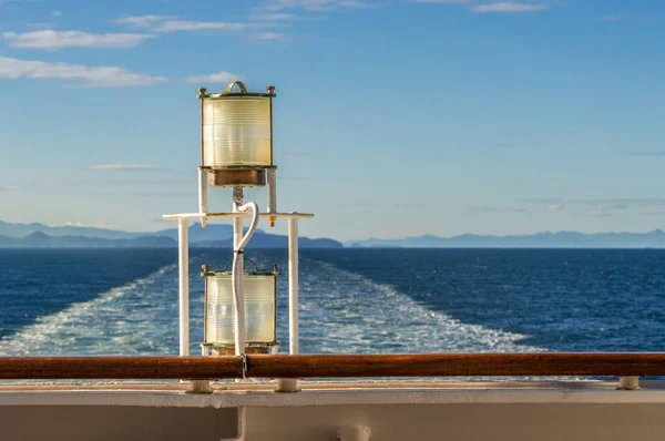 Sunlit glass and metal sternlight of ship. Stephens Passage, Alaska, USA. — Stock Photo, Image