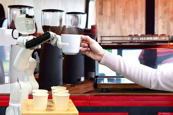 Robot hold hot coffee drinks to people work instead of man future 4.0 technology