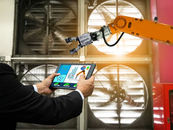 Machine tablet control and robot arm industrial in a factory